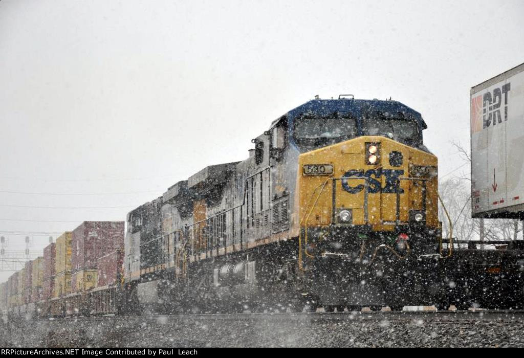 Stack train races east through the snow